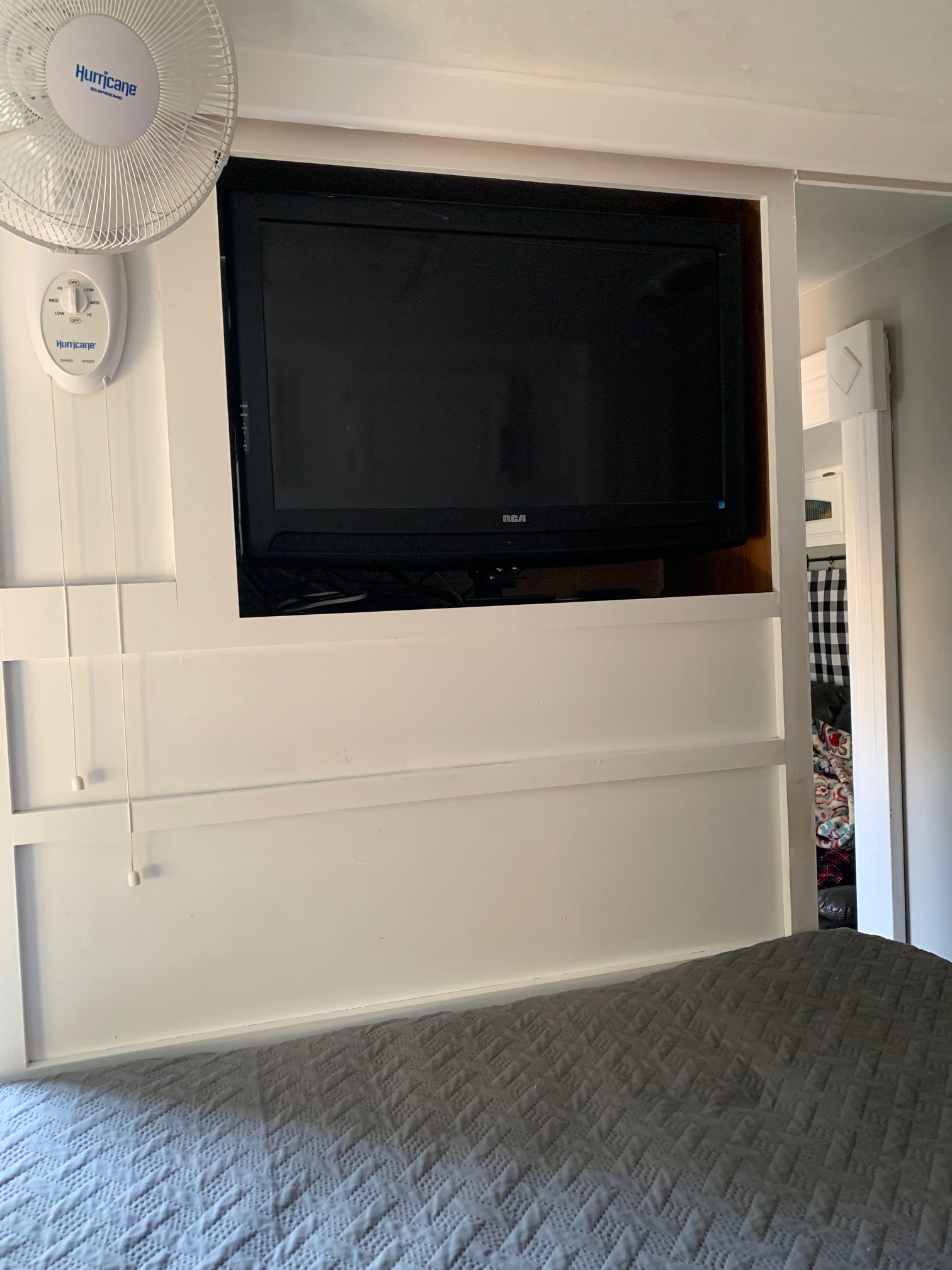 Bedroom with wall-mounted TV
